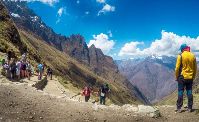 Classic postcard view of Machu Picchu citadel and Huayna Picchu mountain from the Sun Gate