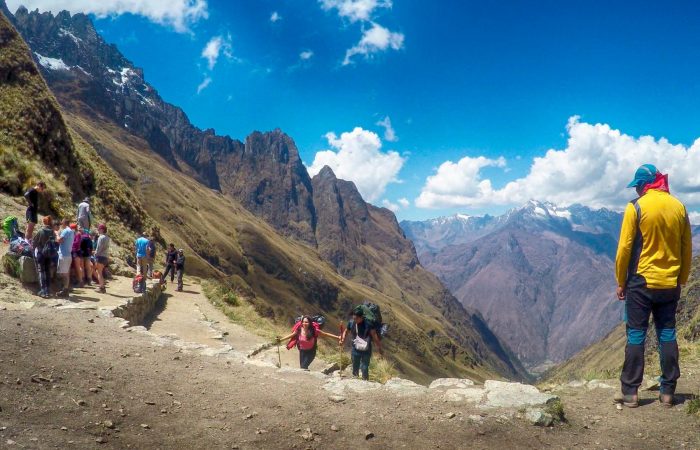 Classic postcard view of Machu Picchu citadel and Huayna Picchu mountain from the Sun Gate