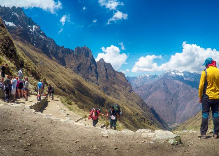 Classic postcard view of Machu Picchu citadel and Huayna Picchu mountain from the Sun Gate