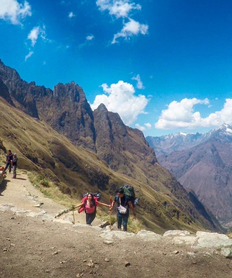 Classic postcard view of Machu Picchu citadel and Huayna Picchu mountain from the Sun Gate