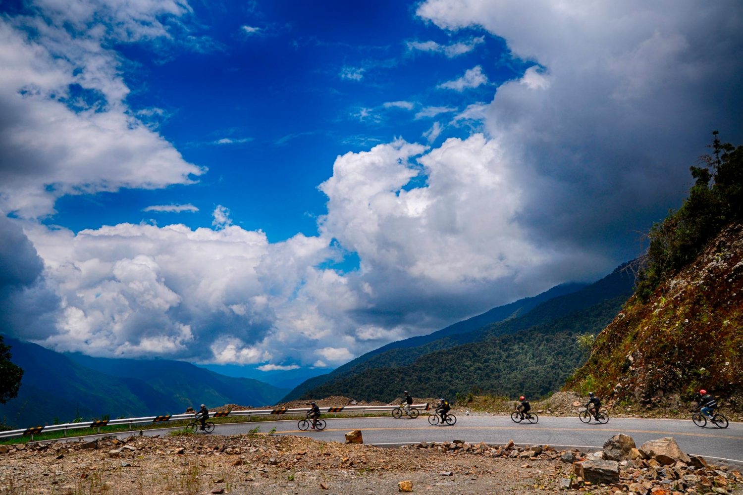 Downhill mountain biking adventure descending through the high Andean mountain pass near Abra Malaga Cusco