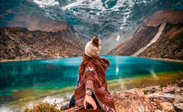 Postcard view of the bright turquoise Humantay Lake nestled under the massive Humantay glacier mountain