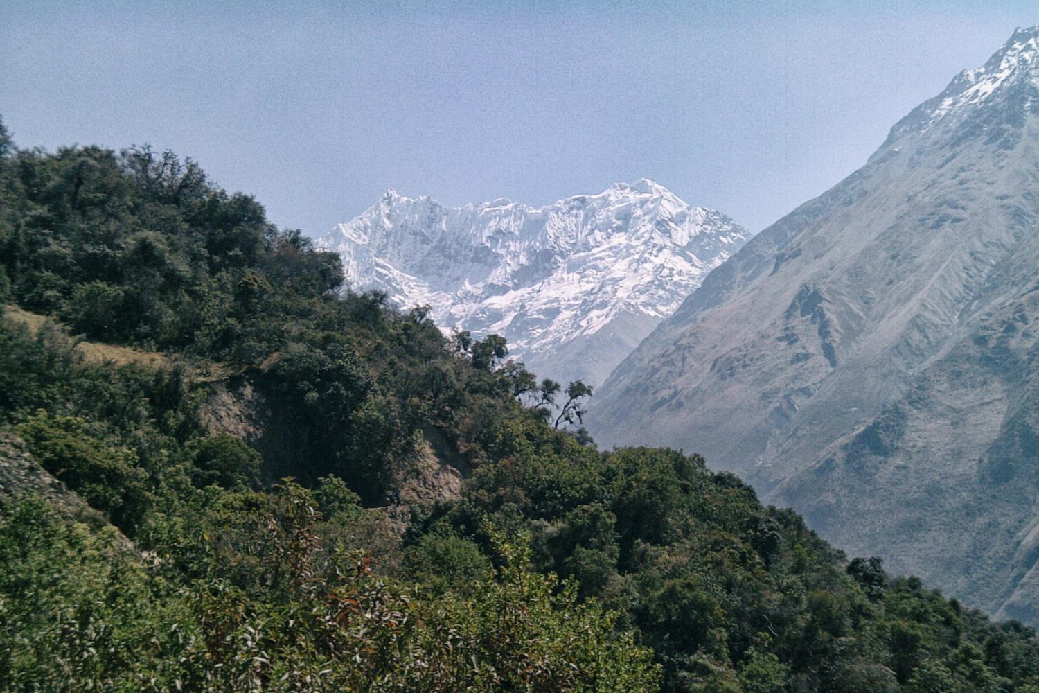 Panoramic view of the wide Salkantay mountain valley with glacier peaks and hiking trails