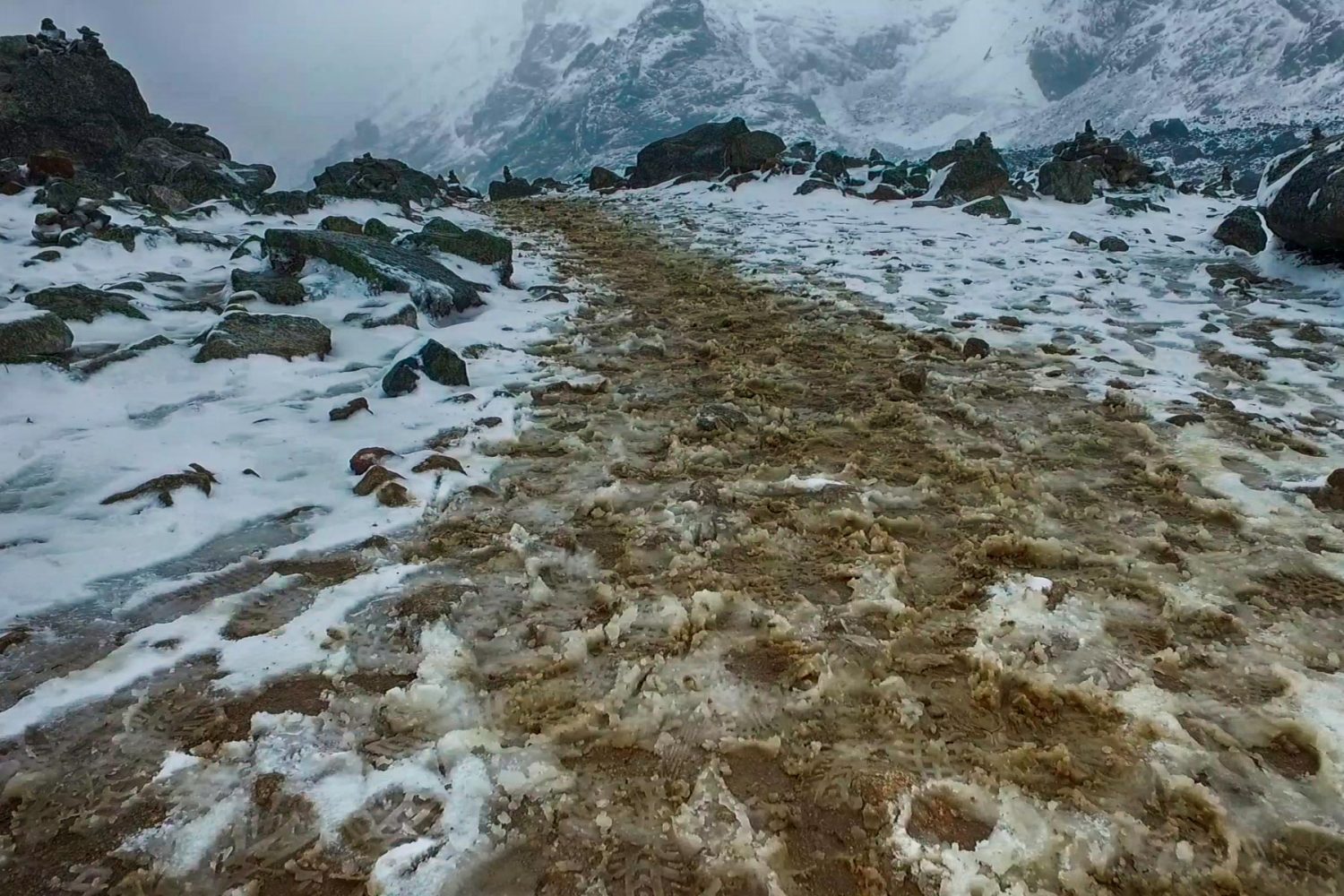 Spectacular view of the snow-capped Salkantay mountain peak rising above a winding dirt trail