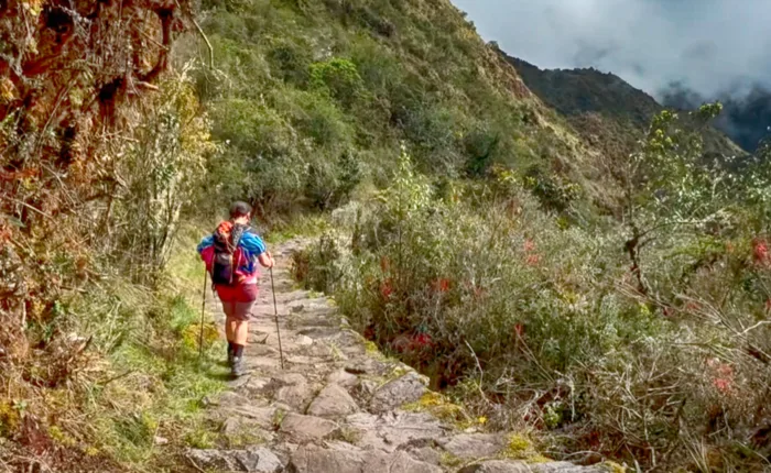 Tourists exploring the ancient stone terraces of Chachabamba ruins on the Short Inca Trail 2 Days