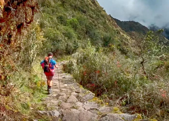 Tourists exploring the ancient stone terraces of Chachabamba ruins on the Short Inca Trail 2 Days